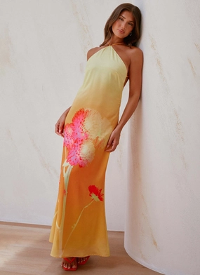 Chloe Maxi Dress - Orange Floral Outdoor Scene